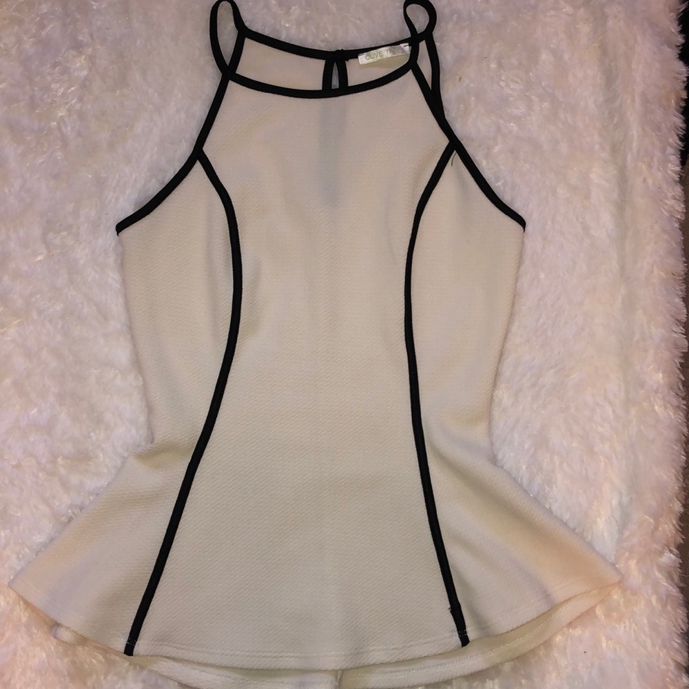 Off white blouse with black detailing.